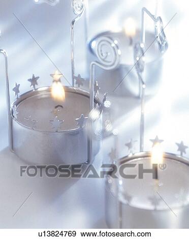 Stock Photo - decorative, silver, ornate, circular, burning, lit. Fotosearch