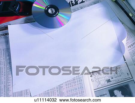 indoor, light, paper, material, newspaper, CD View Large Photo Image Stock Image - indoor, light, paper, material, newspaper, CD. Fotosearch