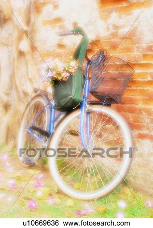 Stock Photograph - setting, bicycle, soft focus, hat, wall, flower. Fotosearch