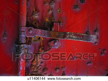 Picture - red, pipe, door, doorknob, material, metal. Fotosearch