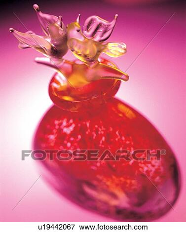 Stock Photo - birds, fragrance, perfume bottle, bottle, pink, belongings. Fotosearch