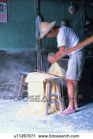 Stock Image - farmer, wooden bench, noodles, calender, duster, wall. Fotosearch