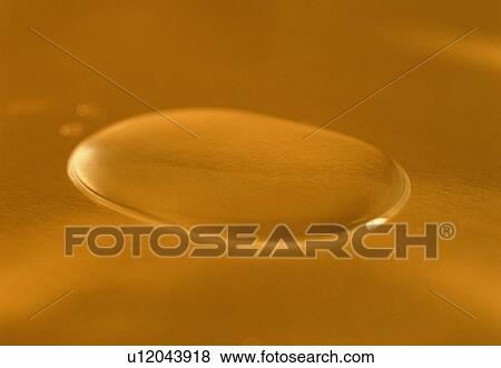 Stock Photo - orange, drop, water, close-up. Fotosearch