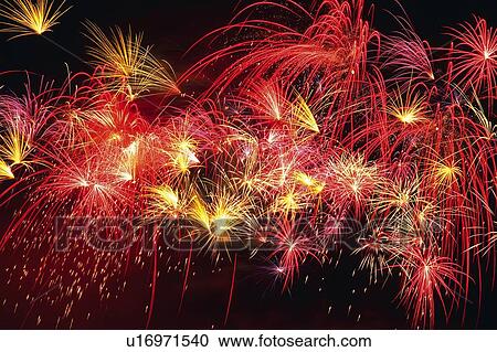 Stock Image -  Multicolored Fireworks Exploding in the Night Sky, Long Exposure, Low Angle View . Fotosearch