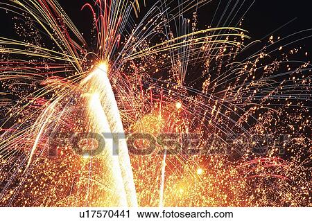 Multicolored Fireworks Exploding in the Night Sky, Long Exposure, Low Angle View View Large Photo Image Stock Image - Multicolored Fireworks Exploding in the Night Sky, Long Exposure, Low Angle View. Fotosearch
