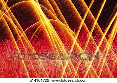 Orange and Red-colored Fireworks in the Night Sky, Long Exposure View Large Photo Image Stock Photo - Orange and Red-colored Fireworks in the Night Sky, Long Exposure. Fotosearch
