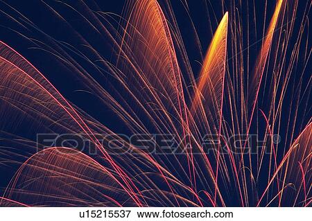 Orange-colored Fireworks Exploding in the Night Sky, Long Exposure, Low Angle View View Large Photo Image Stock Photo - Orange-colored Fireworks Exploding in the Night Sky, Long Exposure, Low Angle View . Fotosearch