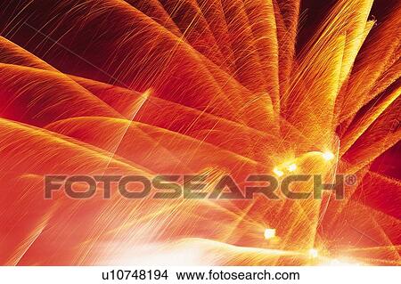 Red and Orange-colored Fireworks Exploding in the Night Sky, Long Exposure, Low Angle View View Large Photo Image Picture - Red and Orange-colored Fireworks Exploding in the Night Sky, Long Exposure, Low Angle View . Fotosearch