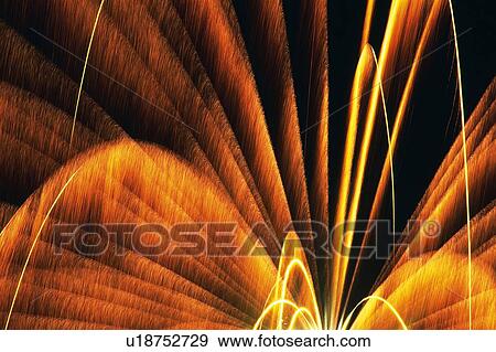 Stock Photo -  Red and Yellow-colored Fireworks Exploding in the Night Sky, Long Exposure, Low Angle View, Blurred Motion . Fotosearch