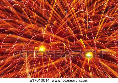 Red-colored Fireworks, Exploding in the Night Sky, Long Exposure, Low Angle View View Large Photo Image Picture - Red-colored Fireworks, Exploding in the Night Sky, Long Exposure, Low Angle View. Fotosearch