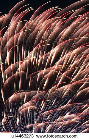 Stock Image -  Several Light Purple-colored Fireworks Exploding in the Night Sky, Long Exposure, . Fotosearch