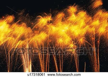 Several Orange-colored Fireworks Exploding in the Night Sky, Long Exposure, Low Angle View View Large Photo Image Stock Image - Several Orange-colored Fireworks Exploding in the Night Sky, Long Exposure, Low Angle View . Fotosearch