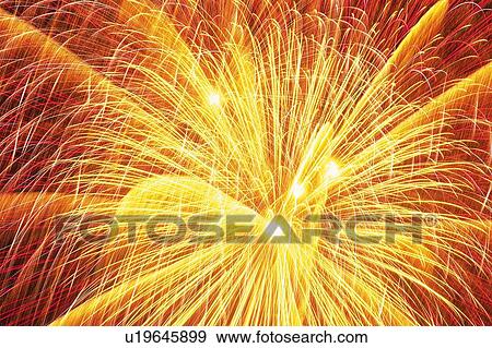 Several Yellow and Red-colored Fireworks, Exploding in the Night Sky, Long Exposure View Large Photo Image Stock Photo - Several Yellow and Red-colored Fireworks, Exploding in the Night Sky, Long Exposure . Fotosearch