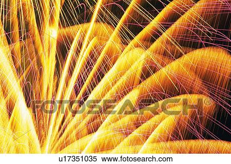 Yellow-colored Fireworks Exploding in the Night Sky, Low Angle View, Long Exposure View Large Photo Image Stock Photography -  Yellow-colored Fireworks Exploding in the Night Sky, Low Angle View, Long Exposure. Fotosearch