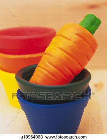 Stock Image - Clay Craft, Carrot, Close Up, Differential Focus. Fotosearch