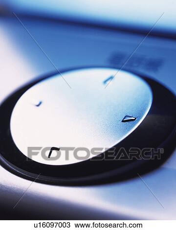Stock Image - A button of an electrical product, Close Up, High Angle View, Differential Focus. Fotosearch