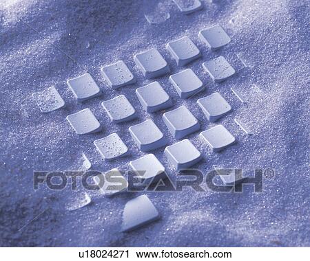 A computer keyboard buried in sand, Close Up, High Angle View View Large Photo Image Stock Image - A computer keyboard buried in sand, Close Up, High Angle View. Fotosearch