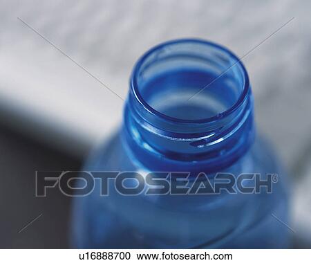 Stock Image - A PET bottle and keyboard, Close Up, High Angle View, Differential Focus. Fotosearch