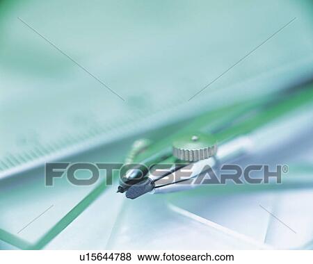 Stock Photo - Compass and rulers, Close Up, High Angle View, Differential Focus. Fotosearch