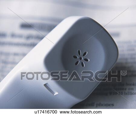 Stock Image - Handset of a telephone, Close Up, High Angle View, Differential Focus. Fotosearch