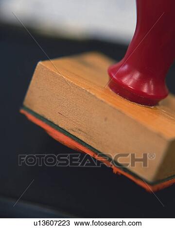 Stock Image - Stamp and ink pad, Close Up, High Angle View, Differential Focus. Fotosearch