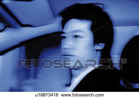 Stock Photograph - Young Businessman Driving. Fotosearch