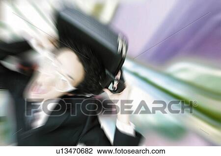Stock Image - Young Businessman Holding Bag On Head. Fotosearch