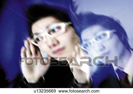 Stock Photo - Young Businessman Holding Glasses. Fotosearch
