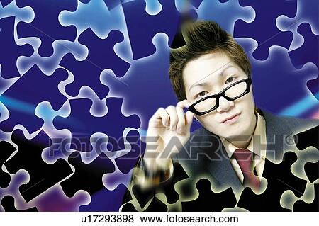 Stock Photo - Young Businessman Holding Glasses. Fotosearch