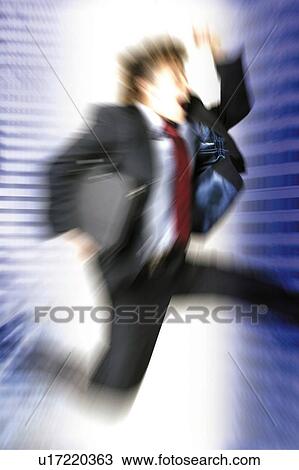 Stock Image - Young Businessman Jumping. Fotosearch