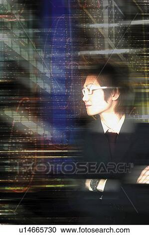 Stock Image - Young Businessman Looking Away. Fotosearch