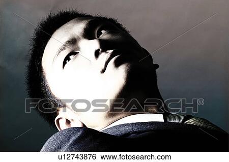 Stock Photograph - Young Businessman Looking Away. Fotosearch