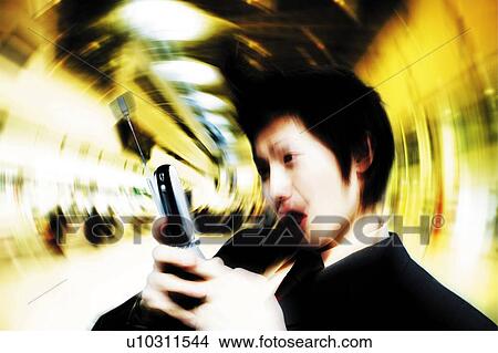 Young Businessman Looking Mobile Phone View Large Photo Image Picture - Young Businessman Looking Mobile Phone. Fotosearch