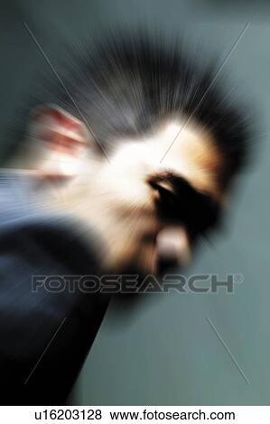 Stock Photo - Young Businessman Looking Over Shoulder. Fotosearch