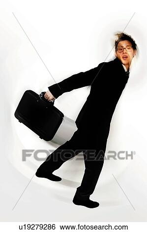 Stock Photograph - Young Businessman Looking Over Shoulder. Fotosearch