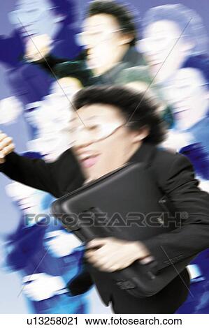 Stock Image - Young Businessman Running. Fotosearch