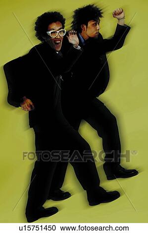 Stock Image - Young Businessmen Walking. Fotosearch