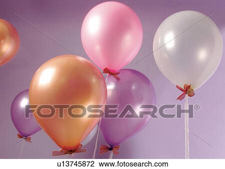 Stock Image - Balloon, Helium Balloon, Indoor, Medium Group Of Objects, Mid-Air. Fotosearch