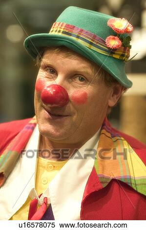 Stock Image of Smiling Clown Wearing A Green Hat u16578075 - Search ...