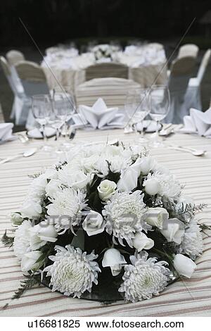 Stock Photography - Close-up of a bouquet of flowers on a dining table. Fotosearch