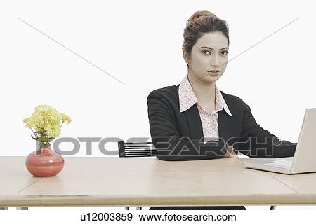 Portrait of a businesswoman in an office View Large Photo Image Stock Photo - Portrait of a businesswoman in an office. Fotosearch