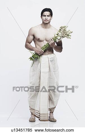 Portrait of a young man in traditional clothing holding a bouquet of flowers View Large Photo Image Stock Photography - Portrait of a young man in traditional clothing holding a bouquet of flowers. Fotosearch