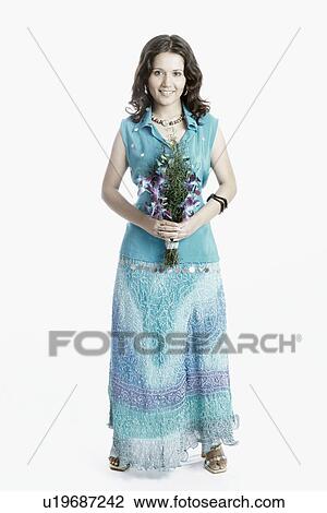 Portrait of a young woman with a bouquet of flowers smiling View Large Photo Image Stock Image - Portrait of a young woman with a bouquet of flowers smiling. Fotosearch