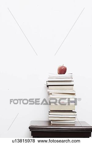 Stock Photo - Apple on a stack of books. Fotosearch