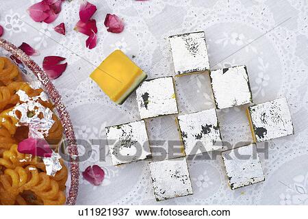 Stock Photo - Close-up of Indian sweets on a table. Fotosearch