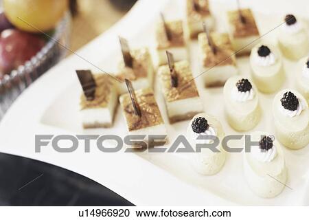 Stock Image - High angle view of cakes on a tray. Fotosearch