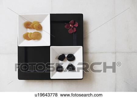 High angle view of dried fruits in a tray View Large Photo Image Stock Photo - High angle view of dried fruits in a tray. Fotosearch