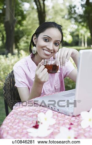 Portrait of a teenage girl holding a cup of tea View Large Photo Image Stock Image - Portrait of a teenage girl holding a cup of tea. Fotosearch