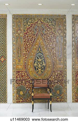 Stock Image - Armchair in front of a wall. Fotosearch
