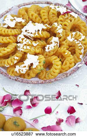 Stock Photo - Close-up of a dish of Indian sweets. Fotosearch